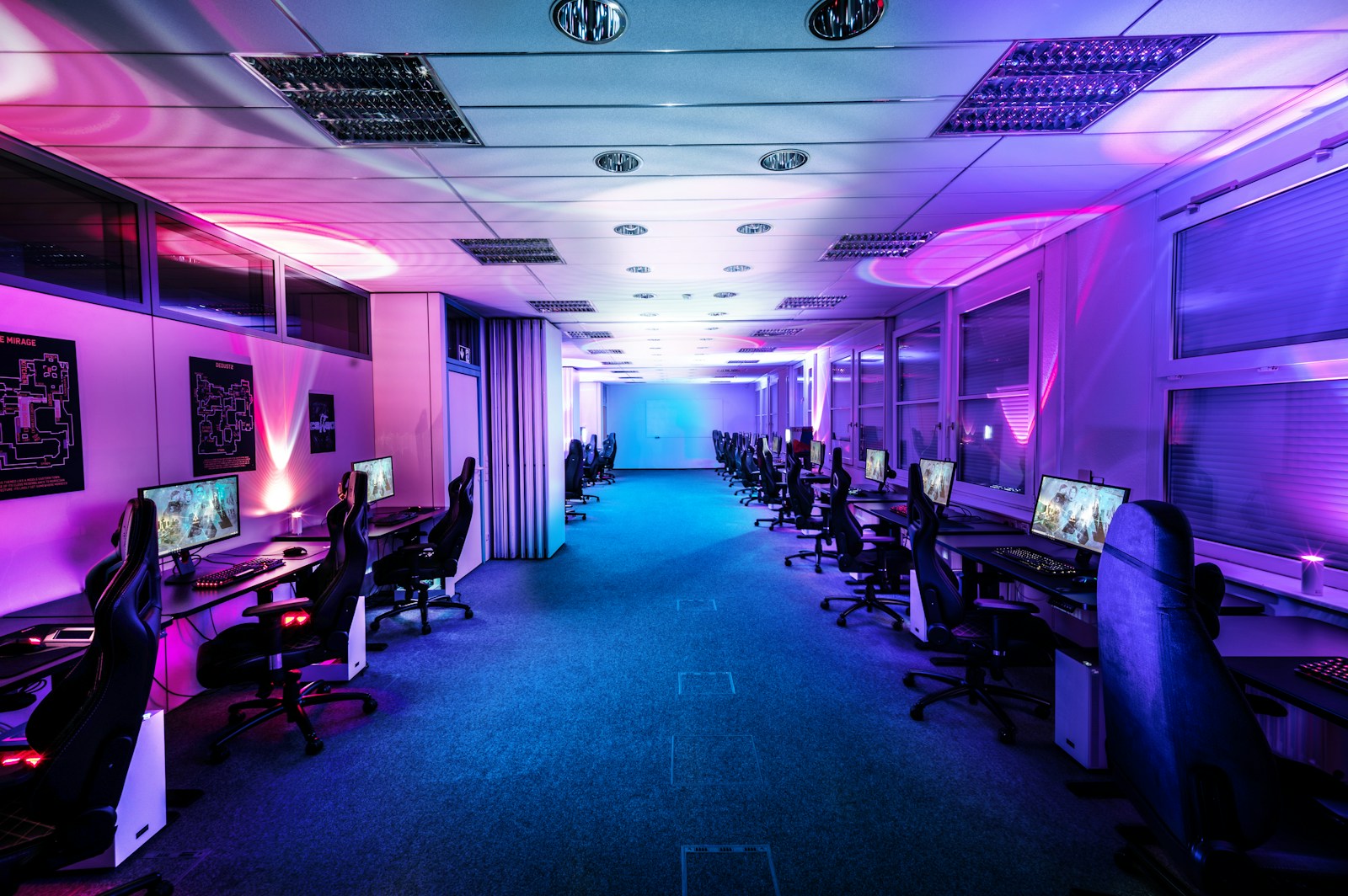 a room filled with lots of computer monitors